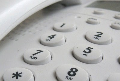 Image of telephone keypad referring that it's good practice to take the lead conference calls.