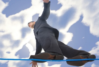 Image of man walking on a tightrope, signifying the need to manage limited resources.