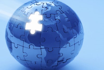 Image of globe made from puzzle pieces with one missing depicting the need to create a responsibilities framework.