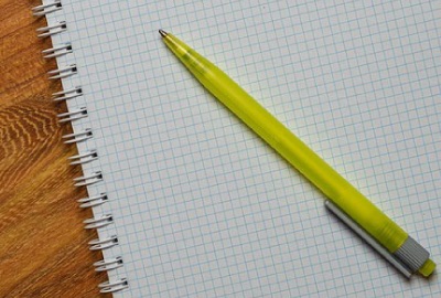 Image of graph pad and pen to be used in defining roles and responsibilities.