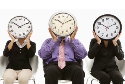 Image of three people with clocks if front of their faces emphasizing the need for relevant time management tips.