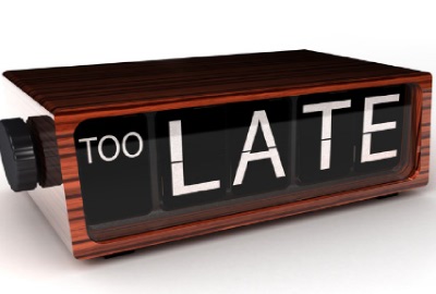 Image of digital flip clock saying 'TOO LATE' signifying the need to manage project delays.